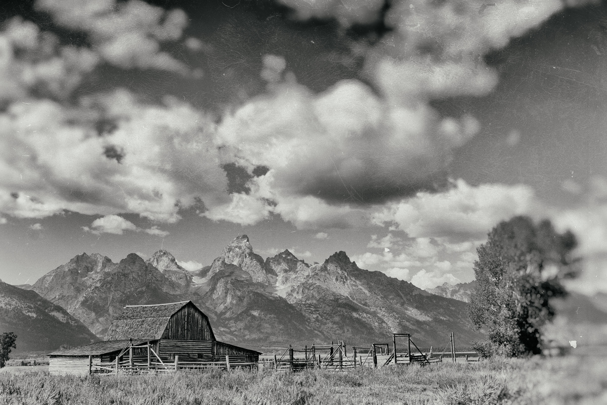 Admire the harmonious blend of history and nature in this fine art photo, featuring the iconic barns of Mormon Row set against...