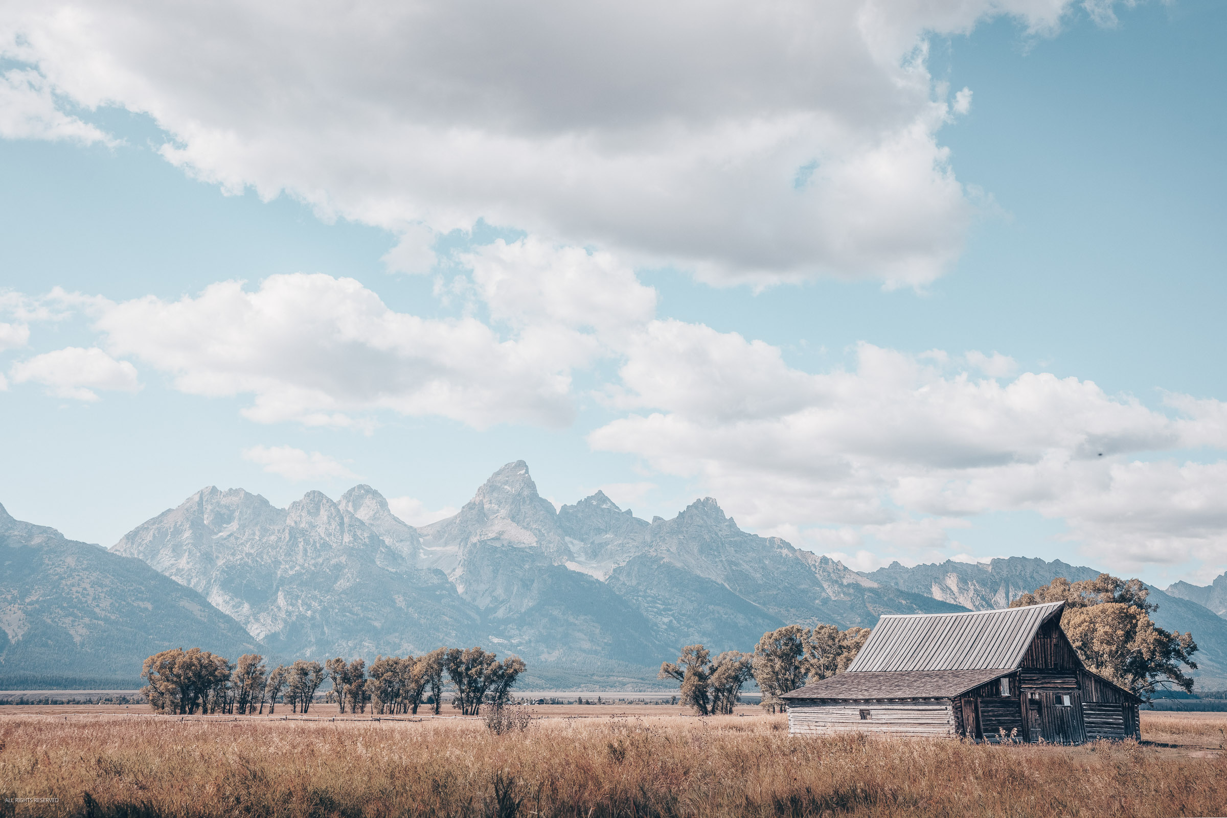 Step into the heart of Wyoming with this stunning fine art print, capturing the historic barns of Mormon Row with the awe-inspiring...